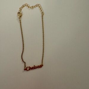 Gold tone bracelet with the name Chelsea